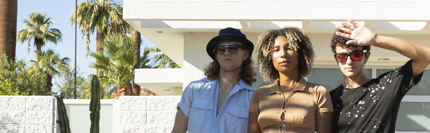 Woman looking at camera with skateboard on her head